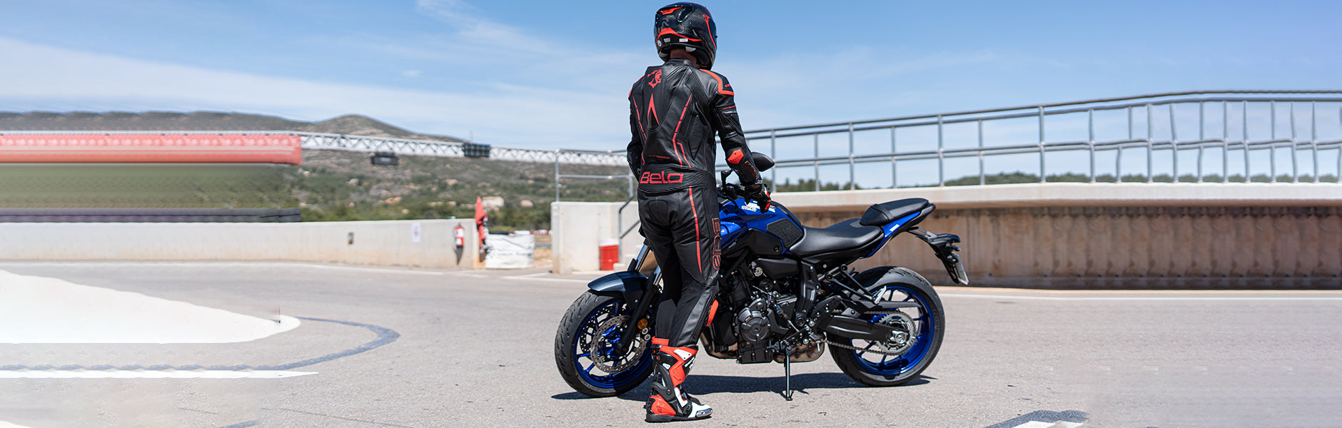 outfitted bela one piece motorcycle suit while riding on  suzuki R g5s
